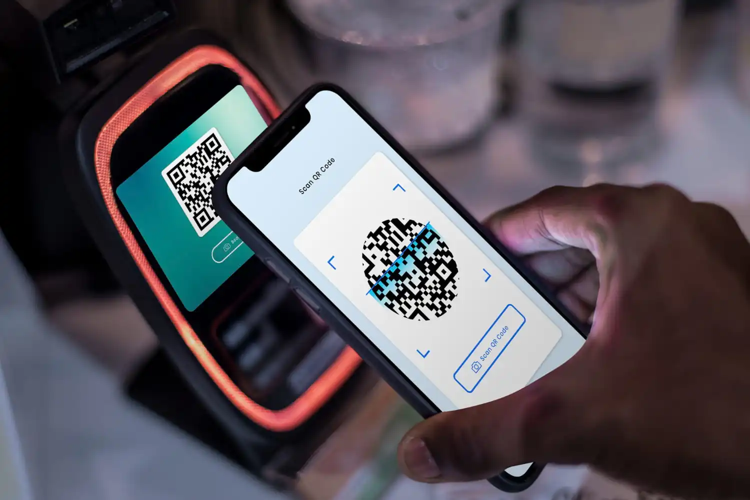 Smartphone scanning a QR code for digital payment